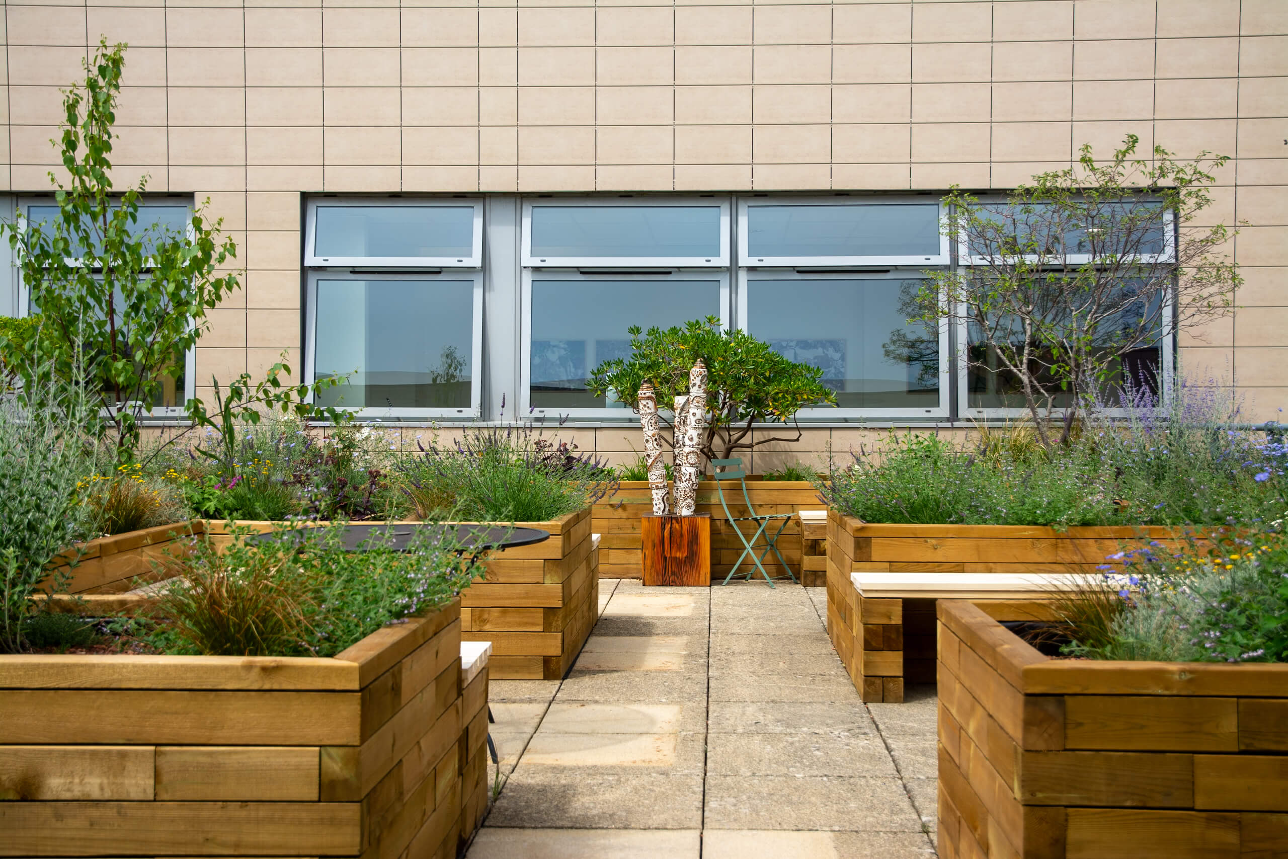 Brick and flint wall with planting